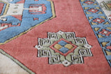 Vintage Turkish rug in a living room setting, pile rug, Turkish rug, vintage rug, portland, rug shop, bright colors, wild shaman, soft rug, bold color, Portland, Oregon, rug store, rug shop, local shop, antique rug