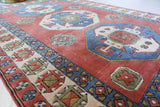 Vintage Turkish rug in a living room setting, pile rug, Turkish rug, vintage rug, portland, rug shop, bright colors, wild shaman, soft rug, bold color, Portland, Oregon, rug store, rug shop, local shop, antique rug