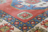 Vintage Turkish rug in a living room setting, pile rug, Turkish rug, vintage rug, portland, rug shop, bright colors, wild shaman, soft rug, bold color, Portland, Oregon, rug store, rug shop, local shop, antique rug