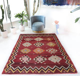 Vintage kilim rug in room decor setting, old rug, antique rug, pastel colors, faded colors, Turkish rug, vintage rug, soft rug, Portland, Oregon, rug store, rug shop, local shop, bold colors, bright colors, faded colors