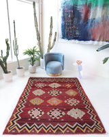 Vintage kilim rug in room decor setting, old rug, antique rug, pastel colors, faded colors, Turkish rug, vintage rug, soft rug, Portland, Oregon, rug store, rug shop, local shop, bold colors, bright colors, faded colors