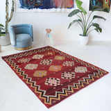 Vintage kilim rug in room decor setting, old rug, antique rug, pastel colors, faded colors, Turkish rug, vintage rug, soft rug, Portland, Oregon, rug store, rug shop, local shop, bold colors, bright colors, faded colors