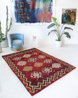 Vintage kilim rug in room decor setting, old rug, antique rug, pastel colors, faded colors, Turkish rug, vintage rug, soft rug, Portland, Oregon, rug store, rug shop, local shop, bold colors, bright colors, faded colors