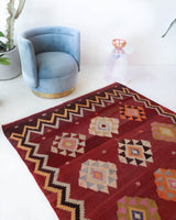 Vintage kilim rug in room decor setting, old rug, antique rug, pastel colors, faded colors, Turkish rug, vintage rug, soft rug, Portland, Oregon, rug store, rug shop, local shop, bold colors, bright colors, faded colors