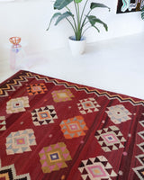 Vintage kilim rug in room decor setting, old rug, antique rug, pastel colors, faded colors, Turkish rug, vintage rug, soft rug, Portland, Oregon, rug store, rug shop, local shop, bold colors, bright colors, faded colors