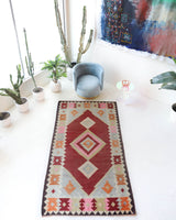 Vintage kilim rug in living room setting, old rug, antique rug, pastel colors, faded colors, Turkish rug, vintage rug, soft rug, Portland, Oregon, rug store, rug shop, local shop, earthy tones, earthy colors, warm colors