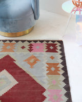 Vintage kilim rug in living room setting, old rug, antique rug, pastel colors, faded colors, Turkish rug, vintage rug, soft rug, Portland, Oregon, rug store, rug shop, local shop, earthy tones, earthy colors, warm colors