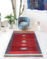 Vintage kilim rug in living room setting, bright colors, wild shaman, soft rug, bold color, Portland, Oregon, rug store, rug shop, local shop, vintage rug, modern kilim, warm colors, antique kilim rug