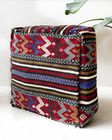 Floor pouf in a living room setting, pillow, turkish pillow, kilim pillow, home decor, decorative pillow, sham, rug pillow,  decor, home decor, pouf, floor cushion, cushion, Portland, rugshop, Oregon, Wild Shaman, ottoman