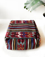 Floor pouf in a living room setting, pillow, turkish pillow, kilim pillow, home decor, decorative pillow, sham, rug pillow,  decor, home decor, pouf, floor cushion, cushion, Portland, rugshop, Oregon, Wild Shaman, ottoman