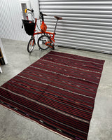 Vintage kilim rug in living room setting, bright colors, wild shaman, soft rug, bold color, Portland, Oregon, rug store, rug shop, local shop, vintage rug, modern kilim, warm colors, antique rug, antique kilim