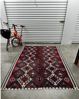Vintage kilim rug in living room setting, bright colors, wild shaman, soft rug, bold color, Portland, Oregon, rug store, rug shop, local shop, vintage rug, modern kilim, warm colors, antique rug, antique kilim