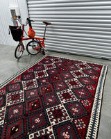 Vintage kilim rug in living room setting, bright colors, wild shaman, soft rug, bold color, Portland, Oregon, rug store, rug shop, local shop, vintage rug, modern kilim, warm colors, antique rug, antique kilim