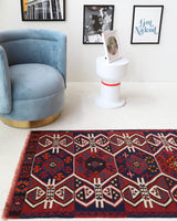 Vintage Turkish runner rug in a living room setting, pile rug, Turkish rug, vintage rug, portland, rug shop, bright colors, wild shaman, soft rug, bold color, Portland, Oregon, rug store, rug shop, local shop, antique rug