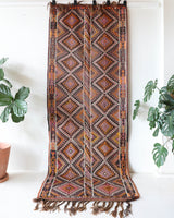 Vintage Turkish runner rug in a living room setting, pile rug, Turkish rug, vintage rug, portland, rug shop, bright colors, wild shaman, soft rug, bold color, Portland, Oregon, rug store, rug shop, local shop, antique rug