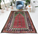 Vintage kilim rug in room decor setting, old rug, antique rug, pastel colors, faded colors, Turkish rug, vintage rug, soft rug, Portland, Oregon, rug store, rug shop, local shop, bold colors, bright colors, faded colors