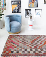 Vintage Turkish runner rug in living room setting, old rug, antique rug, pastel colors, faded colors, Turkish rug, vintage rug, soft rug, Portland, Oregon, rug store, rug shop, local shop