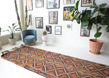 Vintage Turkish runner rug in a living room setting, pile rug, Turkish rug, vintage rug, portland, rug shop, bright colors, wild shaman, soft rug, bold color, Portland, Oregon, rug store, rug shop, local shop, antique rug