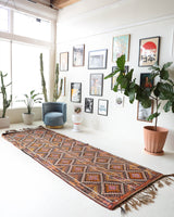 Vintage Turkish runner rug in a living room setting, pile rug, Turkish rug, vintage rug, portland, rug shop, bright colors, wild shaman, soft rug, bold color, Portland, Oregon, rug store, rug shop, local shop, antique rug