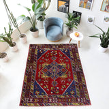 Vintage Turkish rug in a living room setting, pile rug, Turkish rug, vintage rug, portland, rug shop, bright colors, wild shaman, soft rug, bold color, Portland, Oregon, rug store, rug shop, local shop