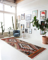 Vintage Turkish runner rug in a living room setting, pile rug, Turkish rug, vintage rug, portland, rug shop, bright colors, wild shaman, soft rug, bold color, Portland, Oregon, rug store, rug shop, local shop, antique rug