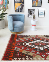 Vintage Turkish runner rug in a living room setting, pile rug, Turkish rug, vintage rug, portland, rug shop, bright colors, wild shaman, soft rug, bold color, Portland, Oregon, rug store, rug shop, local shop, antique rug