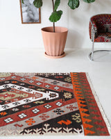 Vintage Turkish runner rug in a living room setting, pile rug, Turkish rug, vintage rug, portland, rug shop, bright colors, wild shaman, soft rug, bold color, Portland, Oregon, rug store, rug shop, local shop, antique rug