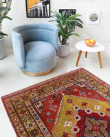 Vintage Turkish rug in living room setting, old rug, antique rug, pastel colors, faded colors, Turkish rug, vintage rug, soft rug, Portland, Oregon, rug store, rug shop, local shop