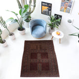 Turkmen rug in a living room setting, pile rug, Turkish rug, vintage rug, portland, rug shop, bright colors, wild shaman, soft rug, bold color, Portland, Oregon, rug store, rug shop, local shop, antique rug