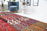 Vintage kilim rug in living room setting, bright colors, wild shaman, soft rug, bold color, Portland, Oregon, rug store, rug shop, local shop, vintage rug, modern kilim, warm colors