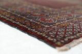 Turkmen rug in a living room setting, pile rug, Turkish rug, vintage rug, portland, rug shop, bright colors, wild shaman, soft rug, bold color, Portland, Oregon, rug store, rug shop, local shop, antique rug