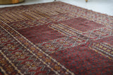 Turkmen rug in a living room setting, pile rug, Turkish rug, vintage rug, portland, rug shop, bright colors, wild shaman, soft rug, bold color, Portland, Oregon, rug store, rug shop, local shop, antique rug