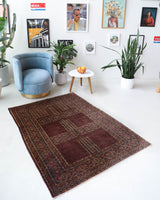 Turkmen rug in a living room setting, pile rug, Turkish rug, vintage rug, portland, rug shop, bright colors, wild shaman, soft rug, bold color, Portland, Oregon, rug store, rug shop, local shop, antique rug