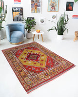 Vintage Turkish rug in living room setting, old rug, antique rug, pastel colors, faded colors, Turkish rug, vintage rug, soft rug, Portland, Oregon, rug store, rug shop, local shop
