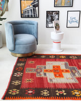 Vintage kilim rug in living room setting, bright colors, wild shaman, soft rug, bold color, Portland, Oregon, rug store, rug shop, local shop, vintage rug, modern kilim, warm colors