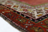 Turkish rug in a living room setting, pile rug, Turkish rug, vintage rug, portland, rug shop, bright colors, wild shaman, soft rug, bold color, Portland, Oregon, rug store, rug shop, local shop, antique rug