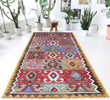 Vintage kilim rug in living room setting, bright colors, wild shaman, soft rug, bold color, Portland, Oregon, rug store, rug shop, local shop, vintage rug, modern kilim, warm colors