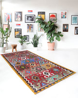 Vintage kilim rug in living room setting, bright colors, wild shaman, soft rug, bold color, Portland, Oregon, rug store, rug shop, local shop, vintage rug, modern kilim, warm colors