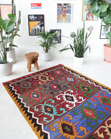Vintage kilim rug in living room setting, bright colors, wild shaman, soft rug, bold color, Portland, Oregon, rug store, rug shop, local shop, vintage rug, modern kilim, warm colors
