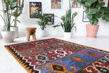 Vintage kilim rug in living room setting, bright colors, wild shaman, soft rug, bold color, Portland, Oregon, rug store, rug shop, local shop, vintage rug, modern kilim, warm colors
