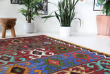 Vintage kilim rug in living room setting, bright colors, wild shaman, soft rug, bold color, Portland, Oregon, rug store, rug shop, local shop, vintage rug, modern kilim, warm colors