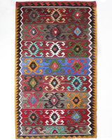 Vintage kilim rug in living room setting, bright colors, wild shaman, soft rug, bold color, Portland, Oregon, rug store, rug shop, local shop, vintage rug, modern kilim, warm colors