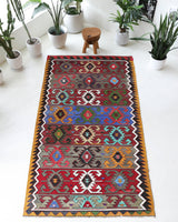 Vintage kilim rug in living room setting, bright colors, wild shaman, soft rug, bold color, Portland, Oregon, rug store, rug shop, local shop, vintage rug, modern kilim, warm colors