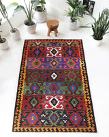 Vintage kilim rug in living room setting, bright colors, wild shaman, soft rug, bold color, Portland, Oregon, rug store, rug shop, local shop, vintage rug, modern kilim, warm colors