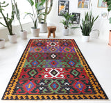 Vintage kilim rug in living room setting, bright colors, wild shaman, soft rug, bold color, Portland, Oregon, rug store, rug shop, local shop, vintage rug, modern kilim, warm colors