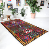 Vintage kilim rug in living room setting, bright colors, wild shaman, soft rug, bold color, Portland, Oregon, rug store, rug shop, local shop, vintage rug, modern kilim, warm colors