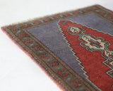 Vintage mini kilim rug in room decor setting, kilim, Turkish rug, vintage rug, portland, rug shop, bright colors, wild shaman, soft rug, bold color, Portland, Oregon, rug store, rug shop, local shop