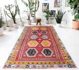 Vintage kilim rug in room decor setting, old rug, antique rug, pastel colors, faded colors, Turkish rug, vintage rug, soft rug, Portland, Oregon, rug store, rug shop, local shop, bold colors, bright colors, faded colors
