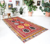 Vintage kilim rug in room decor setting, old rug, antique rug, pastel colors, faded colors, Turkish rug, vintage rug, soft rug, Portland, Oregon, rug store, rug shop, local shop, bold colors, bright colors, faded colors