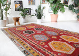 Vintage kilim rug in room decor setting, old rug, antique rug, pastel colors, faded colors, Turkish rug, vintage rug, soft rug, Portland, Oregon, rug store, rug shop, local shop, bold colors, bright colors, faded colors